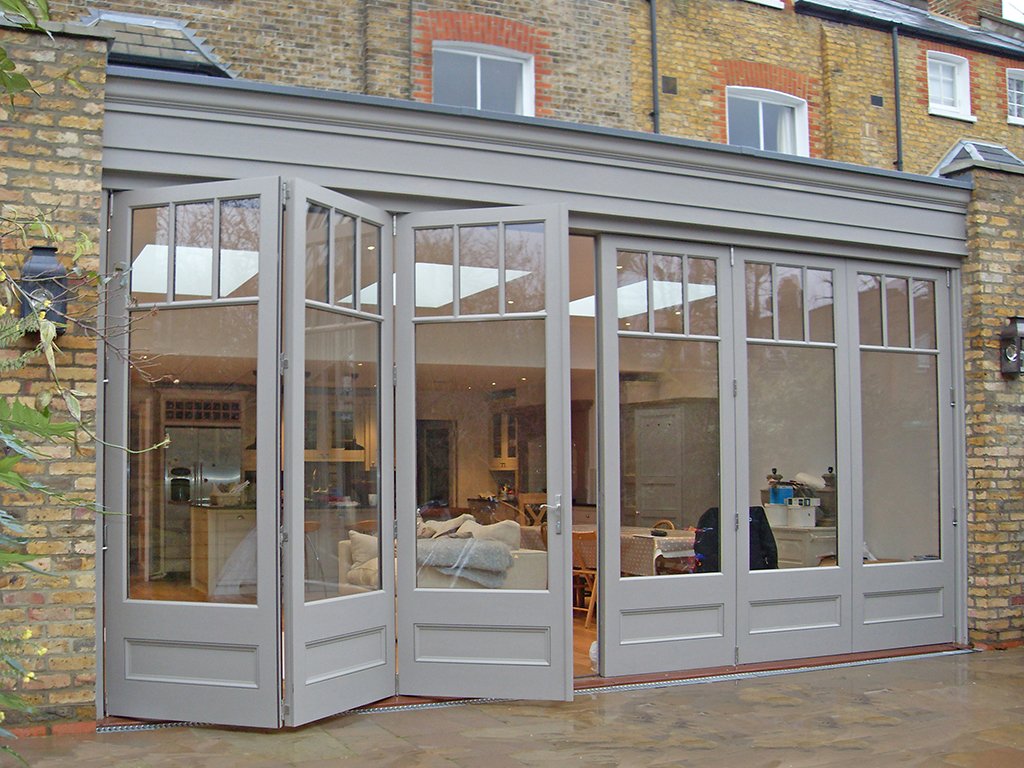 3m high doors help daylight flood into this orangery extension