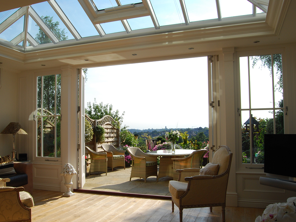 Rear extension with a roof lantern and french doors and fanlights.