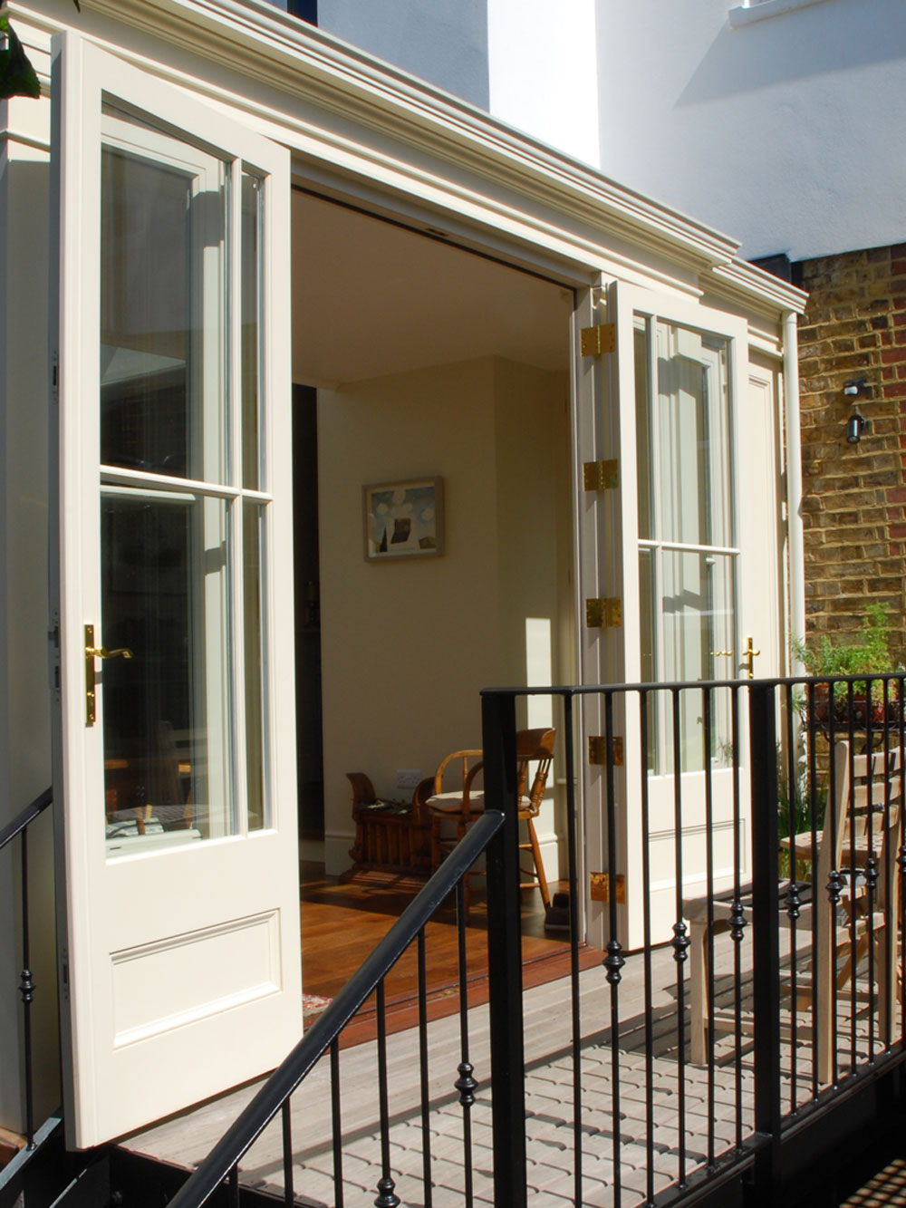 French doors featuring a panel base design and glazing pattern