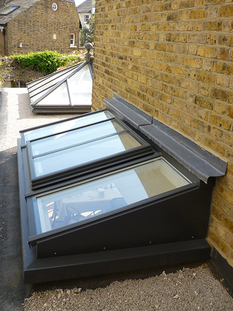 Bespoke rectangular roof lantern sits centerally in this orangery extension