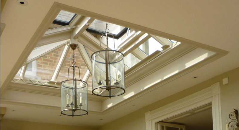 Pendant lighting hung from a roof lantern