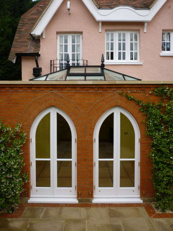 A roof lantern centres perfectly on the principal elevation of a masonry orangery